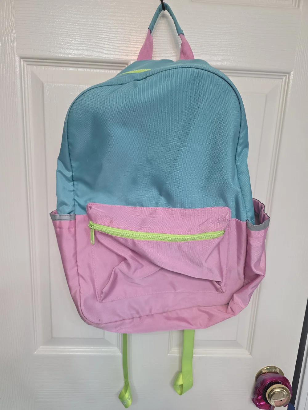 Pottery Barn Kids Astor Backpack featuring pink, aqua, and lime green colors.